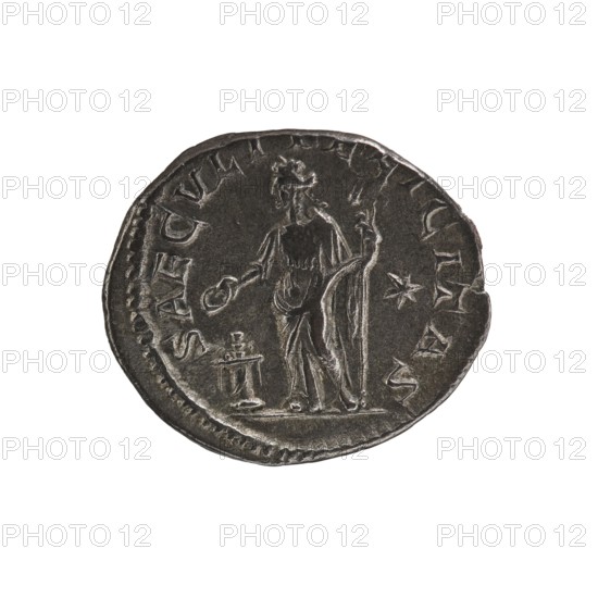 Denarius, Elagabalus reigned 218–222. Obv.: IVLIAMAESAAVG — Draped bust of Julia Maesa facing right, pearl rim. Rev.: SAECVLIFELICITAS — Felicitas standing facing left, holding a patera above a burning altar in her right hand and a long caduceus in her left, pearl rim. Date: 218–223. Roman Empire; Rome. Coin; diameter 18.0–18.5 mm; weight 2.20 g., A round coin with a dark metallic surface showing wear and raised details, featuring a standing robed figure holding a long staff in one hand and a circular object in the other, a small raised pedestal or altar nearby, a small star-shaped mark beside the figure, and visible edge irregularities; colors visible include dark gray, lighter gray highlights, and subtle brownish tones.