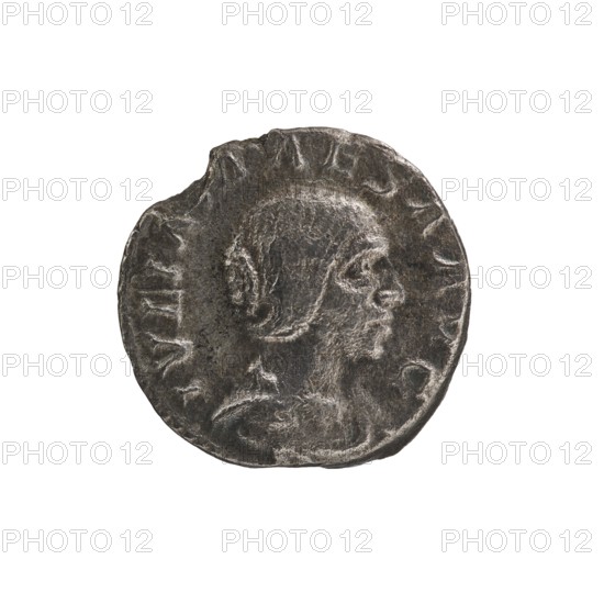 Denarius, Elagabalus 204–222; Roman emperor 218–222. Obv.: IVLIA MAESA AVG — draped bust of Julia Maesa facing right, pearl border. Rev.: SAECVLI FELICITAS — Felicitas standing left; in her right hand she holds a patera above a burning altar, in her left hand a long caduceus; star in right field, pearl border. Roman Empire, 218–223, Rome. Coin; diameter 16.5–17.0 mm, weight 1.95 g., A worn circular metal coin with an uneven edge showing a raised profile of a person facing right; the coin surface is textured with scratches and areas of wear, and the colors visible are dark gray, lighter gray highlights, and subtle brownish-gray tones.
