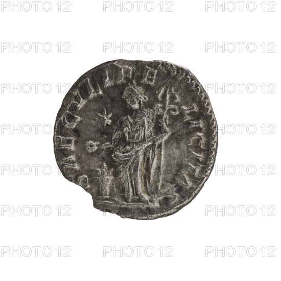 Denarius, Elagabalus 204–222; Roman emperor 218–222. Roman Empire. Obverse: IVLIA MAESA AVG — draped bust of Julia Maesa facing right, pearl border. Reverse: SAECVLI FELICITAS — Felicitas standing left, holding a patera above a burning altar in her right hand and a long caduceus in her left; star in right field, pearl border. 218–223, Rome. Coin; diameter 16.5–17.0 mm, weight 1.95 g., A worn round coin with a tarnished metallic surface in shades of gray and dark silver, showing the faint raised outline of a standing figure draped in a long garment, with a few indistinct raised shapes around the figure and along the coin's scalloped edge, and a small irregular chip on one side.