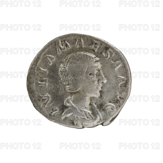 Denarius, Elagabalus Roman emperor 218–222. Obverse: IVLIA MAESA AVG — Draped bust of Julia Maesa facing right, pearl border. Reverse: SAECVLI FELICITAS — Felicitas standing left; in her right hand a patera held above a burning altar, in her left a long caduceus; star in right field, pearl border. Rome; 218–223; Roman Empire. Coin; diameter 17.0–19.0 mm; weight 2.52 g., A round metallic coin with a worn surface showing a raised profile of a person facing right; the figure has short hair and a visible ear and neck, and is depicted wearing draped clothing. The coin's edge is irregular and slightly dented in places, and the surface shows areas of darker and lighter gray with some subtle brownish patina. The background is plain white.