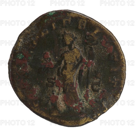 dupondius, Elagabalus 204–222; Roman emperor 218–222. Obv.: IVLIAMAESAAVG — Bust of Julia Maesa in drapery and diadem facing right, pearl border. Rev.: SAECVLIFELICITAS — Felicitas stands facing left, holding a patera above a burning altar in her right hand and a long caduceus in her left; star in right field, S C on sides, pearl border. 218–223, Roman Empire; Rome. Coin; diameter ~24–25 mm; weight 11.50 g., A round, worn coin with an uneven, slightly irregular edge showing a central raised figure in low relief; the surface displays a patina of dark brown and black with a few areas of green and several patches of reddish-brown, and there are traces of a muted golden tone on raised parts of the design.