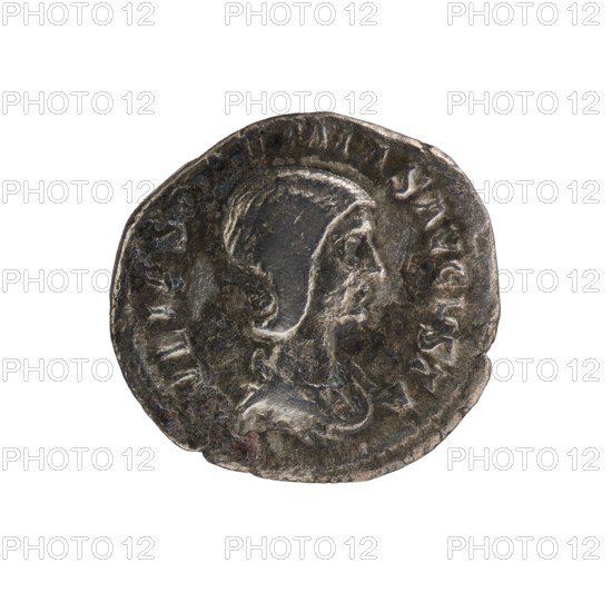 Denarius, Elagabalus reigned 218–222 CE. Obverse: Draped bust of Julia Soaemias facing right, pearl rim; legend IVLIASOAEMIASAVGVSTA. Reverse: Juno standing right, holding a sceptre in her right hand and a palladium in her left; legend IVNO REGINA, pearl rim. Issued by Julia Soaemias Augusta 218–222. Roman Empire, Rome, ca. 218–222 CE. Coin; diameter ~18.0–18.5 mm, weight 2.62 g., A round metallic coin with a worn, uneven edge showing a profile of a person facing right in the center; the figure appears to wear a head covering or helmet and has defined facial contours and a visible neck and shoulder. The coin surface is textured and shows areas of wear and patina. Colors visible include dark gray, lighter silver-gray highlights, and small patches of brownish discoloration.