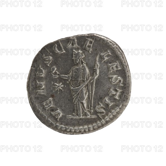 Denarius, Elagabalus 204–222; Roman emperor 218–222. Obverse: IVLIA SOAEMIA SAVG — draped bust of Julia Soaemias facing right, pearl border. Reverse: VENVS CAELESTIS — Venus standing left, holding an apple in her right hand and a scepter in her left, star in left field, pearl rim. Issuer: Julia Soaemias 180–222. Iconography: Venus, Standing Venus with an apple. Date: 218–222. Place of origin: Rome, Roman Empire 27 BC–476. Coin. Diameter 17.5–18.5 mm; weight 2.82 g., A circular metallic object with a worn surface showing a standing human figure in low relief, draped in robes and wearing a headpiece, holding a long staff in one hand and extending the other hand outward toward a small star-like shape; the object has an uneven rim with decorative beading and a patina of dark gray and lighter silver tones, with small areas of darker discoloration and subtle scratches across the surface.
