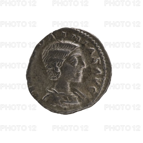 Denarius, Elagabalus 204–222; Roman emperor 218–222, issuer: Julia Soaemias 180–222; Augusta 218–222. Obverse: IVLIA SOAEMIAS AVG — Draped bust of Julia Soaemias facing right, pearl border. Reverse: VENVS CAELESTIS — Venus seated on a throne facing left, holding an apple in her right hand and a scepter in her left; at her feet stands a child with outstretched arms, pearl border. Rome; 218–222 CE. Coin denarius, diameter c.17.0–17.5 mm, weight 2.00 g., A round metallic coin with a dark gray to brownish patina showing the raised profile of a person facing right; the person has short, wavy hair and a visible ear, and is depicted from the shoulders up with clothing folds suggested at the neckline; the coin edge is irregular and slightly raised with a patterned rim on one side; overall colors visible are dark gray, brown, and a few lighter gray highlights.