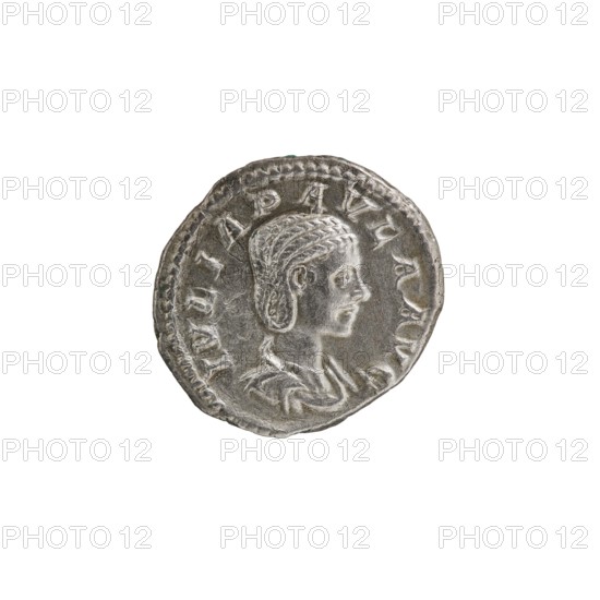 Denarius, Elagabalus Roman emperor 218–222. Obverse: Draped bust of Julia Paula facing right, pearl rim, legend IVLIAPAVLAAVG. Reverse: Concordia seated left, holding a patera in her right hand, resting her left elbow on the back of the throne, star in left field, pearl rim. 219–220 CE. Roman coin Rome mint. Diameter ~18.5–19.0 mm; weight 3.00 g., A round metallic coin with a raised profile of a person facing right, showing textured hair and detailed facial features, worn edges, and a rim with decorative indents; the coin appears in shades of silver and gray against a plain white background.