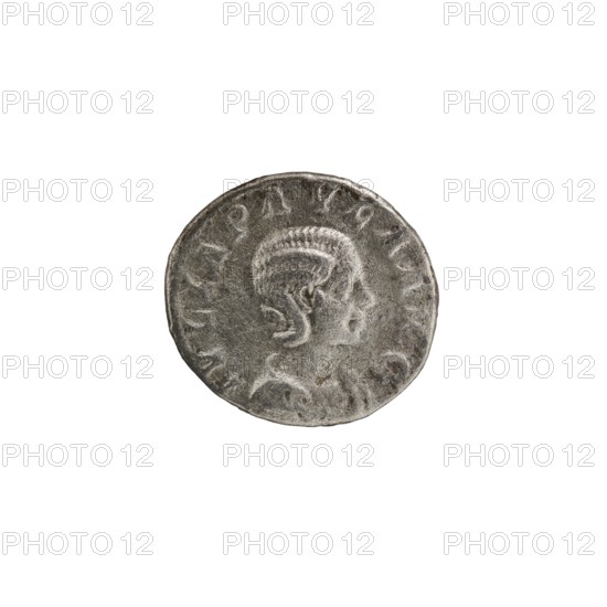 Denarius, Elagabalus 204–222; Roman emperor 218–222, issuer Julia Paula ca. 190–235; Roman empress 219–220. Obv.: IVLIAPAVLAAVG — Draped bust of Julia Paula facing right, pearl border. Rev.: CONC ORDIA — Concordia seated left, holding a patera in her right hand, resting the elbow of her left hand on the back of the throne; star in left field, pearl border. 219–220, Roman Empire; Rome. Coin, diameter 18.5–19.0 mm, weight 3.00 g., A round coin with a raised profile of a person facing right, showing detailed hair and facial features; the coin surface is textured with worn high points and recessed areas; the edge is slightly irregular; colors visible include shades of gray, silver, and darker gray tones.