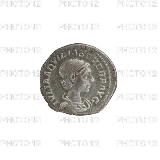 Denarius, Elagabalus Roman emperor 218–222. Issuer: Aquilia Severa Roman empress 221–222. Obverse: IVLIAAQVILIASEVERAAVG — draped bust of Aquilia Severa facing right, pearl border. Reverse: CONCORDIA — Concordia standing left, holding a patera above a burning altar in her right hand and a double cornucopia in her left; star in right field, pearl border. Date: 220. Place of origin: Rome, Roman Empire. Coin; diameter ~18.5–19.0 mm; weight 3.00 g., A circular metallic object with a worn surface depicting a profile of a person facing right; the figure has short, textured hair and a visible ear, and wears draped clothing at the neck. The object shows raised edges and irregularities along its rim, with areas of lighter and darker silver-gray tones across its surface. The surrounding background is plain white.