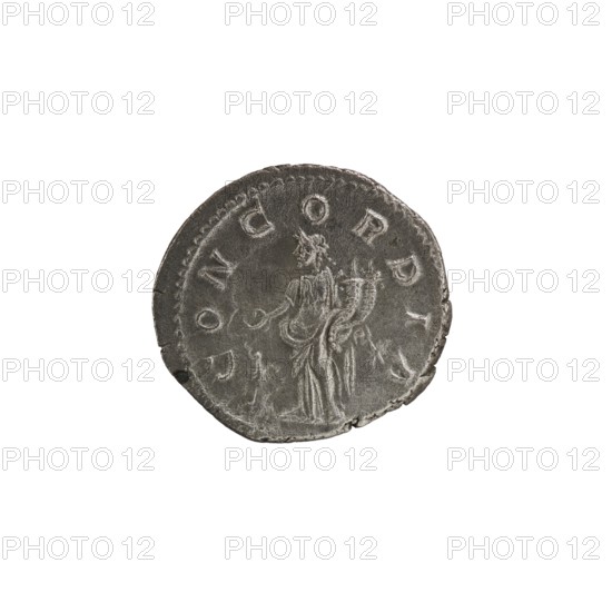 Denarius of Elagabalus reigned 218–222 CE. Obverse: IVLIAAQVILIASEVERAAVG — draped bust of Aquilia Severa facing right; pearl border. Reverse: CONCORDIA — Concordia standing left, holding a patera above a burning altar in her right hand and a double cornucopia in her left; star in right field; pearl border. Date: 220 CE. Place of origin: Rome. Material: coin. Diameter: 18.5–19.0 mm. Weight: 3.00 g. Maker/issuer: Aquilia Severa fl. 220–222; Roman empress 221–222., A single round metal coin with a worn surface sits against a white background; the coin is primarily gray with darker and lighter gray areas showing wear and texture, and it has a slightly irregular edge. On the coin’s face is a raised depiction of a standing robed figure seen from the side, holding an object and with drapery details visible, and there is a faint decorative border around the rim.