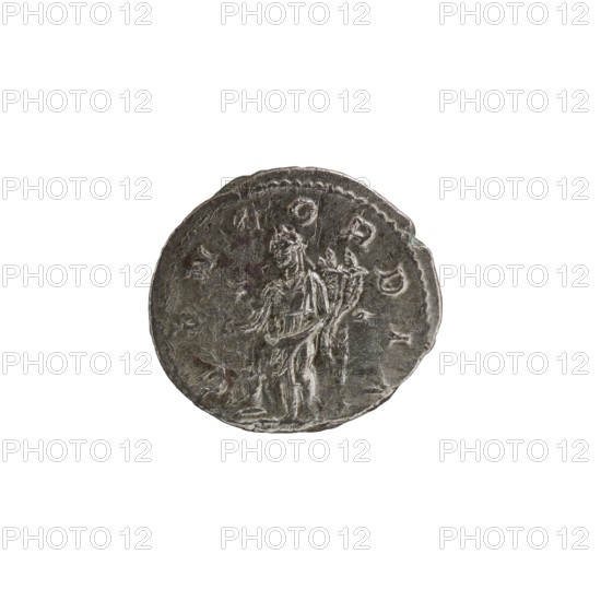 Denarius, Elagabalus 204–222; Roman emperor 218–222. Issuer: Aquilia Severa fl. 220–222; Roman empress 221–222. Roman Empire, Rome, 220 CE. Obverse: IVLIA AQVILIA SEVERA AVG — Draped bust of Aquilia Severa facing right, pearl border. Reverse: CONCORDIA — Concordia standing left, holding a patera above a burning altar in her right hand and a double cornucopia in her left, pearl rim. Silver coin; diameters ca. 17.5–19.0 mm; weight 2.90 g., A round, worn metallic coin with a textured surface showing a raised, weathered figure in profile standing and holding a vertical object behind them; the coin's edge is irregular and slightly chipped in places. The visible colors are silver-gray with darker gray areas and small patches of brownish discoloration. The background is plain white.