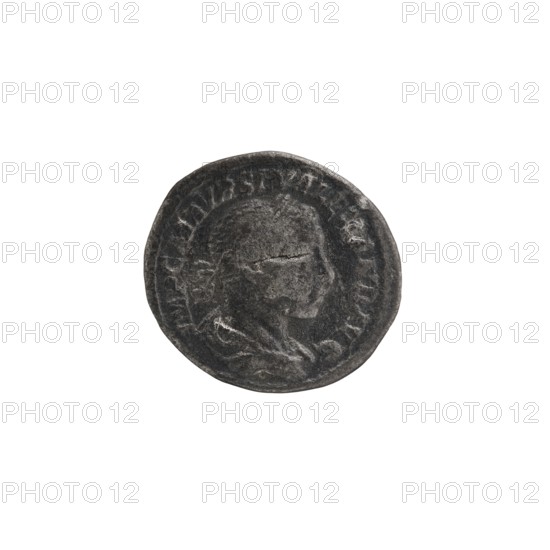 Denarius; Obv.: IMPCMAVRSEVALEXANDAVG — Bust of Alexander Severus with laurel wreath and paludamentum facing right, pearl rim. Rev.: PMTRP COSPP — Jupiter naked in a cloak stands facing left, holding a thunderbolt in his right hand and a long scepter in his left, pearl rim. Roman Empire, 222 CE; Rome. Coin; diameter 17.0–19.0 mm; weight 2.60 g., A round, worn metal coin with a raised profile of a person's head in the center, showing facial features and hair in relief; the coin surface is textured and shows signs of wear and scratches. The coin is predominantly dark gray with lighter gray highlights on the raised areas and edges. The background is plain white.