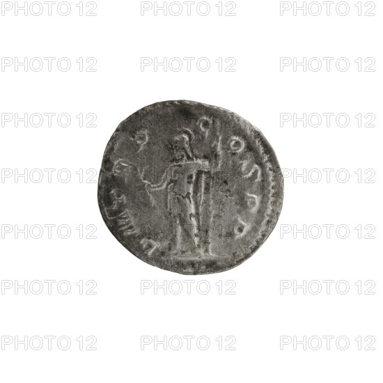 Denarius of Alexander Severus reigned 222–235. Obverse: Bust of Alexander Severus with laurel wreath and paludamentum facing right; pearl border; inscription IMPCMAVRSEVALEXANDAVG. Reverse: Mars in military dress and helmet standing left, holding a branch in his right hand and leaning his left against a standing spear; pearl border; inscription PMTRP C OSPP. Minted Rome, 222. Coin; diameter ~18–19 mm; weight 2.41 g., A round, worn coin in shades of gray and dark silver sits against a white background, showing a raised central figure in a standing pose with one arm extended and the other holding a vertical object; the coin surface is textured with worn relief and a few irregular edges, and there is a faint ring of raised marks around the perimeter.