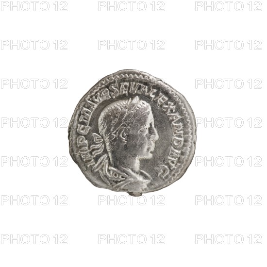 Denarius, Alexander Severus 208–235; Roman emperor 222–235. Obverse: IMPCMAVRSEVALEXANDAVG — Bust of Alexander Severus in laurel wreath, armor and paludamentum facing right, pearl border. Reverse: MARTIPACIFERO — Mars in military dress and helmet standing left, holding a branch in his right hand, resting his left on a standing spear, pearl border. 222–228 CE, Rome. Coin; diameter 18.5–19.0 mm, weight 2.80 g., A circular silver coin with a raised profile of a person's head facing right, showing short hair and a tied ribbon at the back; the portrait sits within a raised border and the coin surface shows worn and textured details with highlights and shadows. The colors visible are silver and gray against a white background.