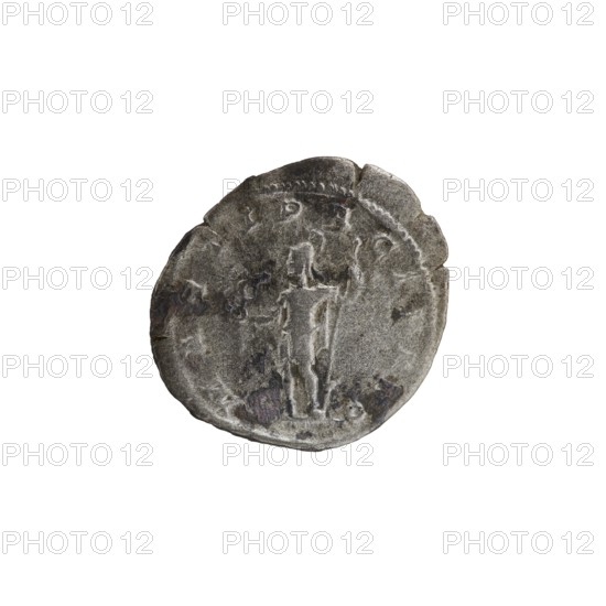 Denarius, Alexander Severus 208–235; Roman emperor 222–235. Obverse: Bust of Alexander Severus with laurel wreath and paludamentum facing right; legend IMPCMAVRSEVALEXANDAVG; pearl rim. Reverse: Mars in military dress and helmet standing left, holding a branch in his right hand and leaning his left against a standing spear; legend MARTIPACIFERO; pearl rim. 222–228 CE. Roman coin; diameter ~17.5–19.5 mm; weight 2.67 g., A worn circular object with irregular edges that appears metallic and predominantly gray, showing darker gray and blackened areas and a few brownish spots; the surface has a raised central figure of a standing person with arms extended, and a faint raised border around the edge; the background is plain white.