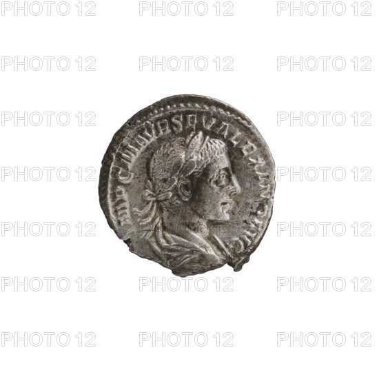 Denarius of Alexander Severus reign 222–235 CE. Obverse: Bust of Alexander Severus wearing a laurel wreath and paludamentum, facing right; legend IMPCMAVRSEVALEXANDAVG. Reverse: Pax standing left, holding an olive branch in her right hand and a scepter in her left; legend PMTR PII COSPP. Pearl rim. Dated 223. Roman coin Rome. Diameter ca. 18.5–19.0 mm; weight 2.83 g., A circular metallic object with a worn surface showing a raised profile of a person facing right wearing a laurel wreath and draped clothing, surrounded by a raised rim and faint decorative elements; visible colors include silver-gray, darker gray tones, and small areas of greenish discoloration.