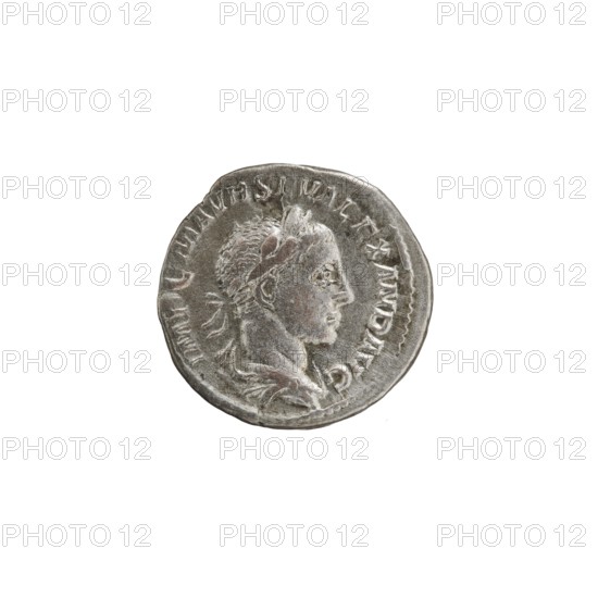 Denarius of Alexander Severus 208–235; Roman emperor 222–235. Obverse: Bust of Alexander Severus with laurel wreath and paludamentum facing right, pearl rim; inscription IMPCMAVRSEVALEXANDAVG. Reverse: Pax standing left, holding an olive branch in her right hand and a scepter in her left; pearl rim; inscription PMTRPI I COSPP. Minted Rome, 223. Silver coin, diameter 18.0 mm, weight 3.11 g., A round metallic coin with a worn relief portrait of a person in profile facing right, showing short textured hair and a laurel-like headband; the coin surface is silver-gray with darker gray shadowing and slight brownish discoloration in places; the coin edge is irregular and the background is plain white.
