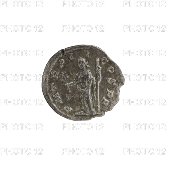 Denarius, Alexander Severus 208–235; Roman emperor 222–235. Obverse: Bust of Alexander Severus with laurel wreath and paludamentum facing right, pearl rim; inscription IMPCMAVRSEVALEXANDAVG. Reverse: Pax standing left, holding an olive branch in her right hand and a scepter in her left; pearl rim; inscription PMTR PII COSPP. Dated 223. Rome, Roman Empire. Coin; diameter ~18–19 mm, weight 2.45 g., A small round metal object with a worn, uneven edge showing a few chips and a visible crack, featuring a raised depiction of a standing figure holding a long staff in one hand and a smaller object in the other; the surface shows scratches and irregularities and a ring of raised shapes around the figure. The predominant color is a dark gray with lighter gray highlights on the raised areas and some subtle brownish tones in spots.