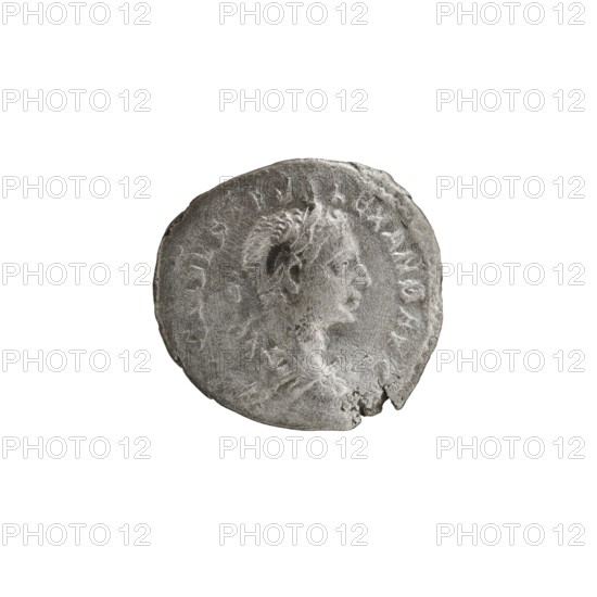 Denarius of Alexander Severus reigned 222–235. Obverse: Bust of Alexander Severus with laurel wreath and paludamentum facing right; legend IMPCMAVRSEVALEXANDAVG; pearl border. Reverse: PAX AETERNA PAXAETERNAAVG — Pax standing left, holding an olive branch in her right hand and a scepter in her left; pearl border. Coin, Roman Empire, struck Rome, c. 222–228; diameter ~18.5–19.5 mm, weight 2.65 g., A round, worn coin with a raised profile of a person facing right, showing facial features and a textured hairstyle; the coin surface appears rough and pitted with uneven edges and a small chip at the rim. The visible colors are shades of gray and silver against a white background.