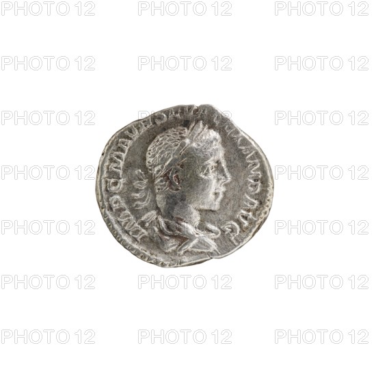 Denarius of Alexander Severus reigned 222–235. Obverse: IMPCMAVRSEVALEXANDAVG — Bust of Alexander Severus with laurel wreath and paludamentum, facing right; pearl border. Reverse: PAXAETERNAAVG — Pax standing left, holding an olive branch in her right hand and a scepter in her left; pearl border. Roman coin, 222–228; diameter ca. 17.5–19.5 mm, weight 2.74 g., A round metallic coin with a worn surface showing a raised profile of a person facing right, hair and facial features in low relief, surrounded by an outer raised rim and decorative edge; the coin appears in shades of silver, gray, and darker tarnished gray, with slight variations of brownish-gray in some recessed areas.