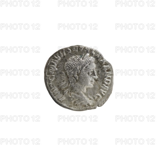 Denarius of Alexander Severus reigned 222–235. Obverse: Bust of Alexander Severus wearing laurel wreath and paludamentum, facing right; inscription IMPCMAVRSEVALEXANDAVG. Reverse: Pax standing left holding an olive branch in her right hand and a scepter in her left; inscription PAXAETERNAAVG. Pearl rim. Coin, Roman Empire, struck in Rome, 222–228. Diameter ca. 16.5–17.5 mm, weight 2.42 g., A worn circular coin with a raised profile of a person facing right; the person has short textured hair and a laurel or leaf-like headpiece, and the coin surface shows signs of aging and uneven wear with rough edges and small chips. Visible colors include shades of gray, silver, and hints of darker gray patina.