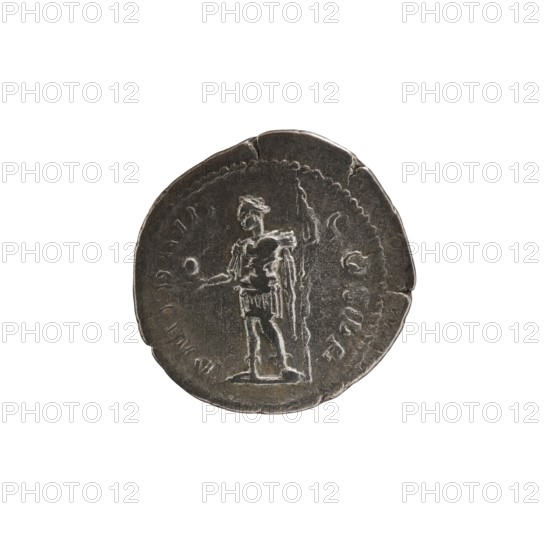 Denarius of Alexander Severus reigned 222–235. Obverse: Bust of Alexander Severus right with laurel wreath and paludamentum; legend IMPCMAVRSEVALEXANDAVG; pearl rim. Reverse: Emperor in military dress standing, head turned left, holding a globe in his right hand and a spear in his left; legend PMTRPIII COSPP; pearl rim. Rome, 224. Roman Empire; coin; diameter 20.5 mm; weight 3.25 g., A round metallic object with a dark gray surface and lighter worn highlights shows the raised outline of a standing human figure wearing a short skirt and a cloak, holding a long vertical staff or spear in one hand and extending the other hand outward toward a small round object; the object has an irregular rim with a few chips and dents and a textured circular border around the central figure, and the background around the object is white.