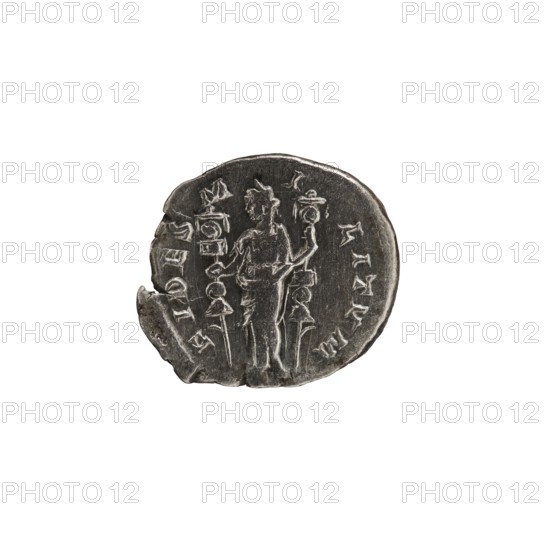 Denarius, personifications. Alexander Severus Roman emperor; 222–235 — iconography: Fides Fidelity, personification. Obverse: IMPCMAVRSEVALEXANDAVG. Bust of Alexander Severus facing right, wearing a laurel wreath and paludamentum; pearl rim. Reverse: FIDES MILITVM. Fides standing upright with head to left, holding a legionary badge in each hand; pearl rim. 222–228 CE. Roman Empire; Rome. Coin. Diameter 16.5–19.0 mm; weight 3.47 g., A round, worn metal coin in shades of gray and dark silver sits against a white background, showing a central standing human-like figure facing slightly left with a few vertical objects or staffs beside and behind them; the coin edge is irregular with a chipped area on the left and visible shallow grooves and raised ridges from the design, and the surface has a mixture of lighter silver highlights and darker gray patina.