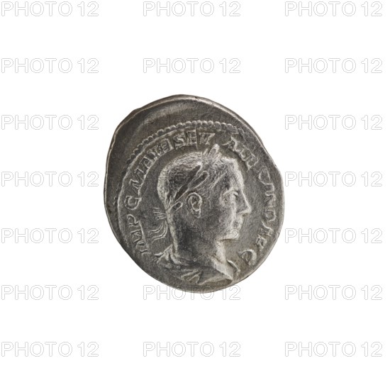 Denarius; personifications; Alexander Severus Roman emperor; 222–235 — iconography: Fides Fidelity, personification. Obv.: IMPCMAVRSEV ALEXANDAVG. Bust of Alexander Severus facing right, wearing a laurel wreath and paludamentum, pearl rim. Rev.: FIDES MILITVM. Fides standing upright with head turned left, holding a legionary badge in each hand, pearl rim. Date: 222–228. Place of origin: Rome. Object type: coin. Diameter: 18.0–20.0 mm. Weight: 3.50 g., A round metallic coin with a worn, textured surface showing a raised profile of a person facing right, with short hair and a laurel-like headband; the coin appears in shades of silver and gray with darker gray shadows and lighter highlights, and there is a raised border and decorative ridge around the portrait.