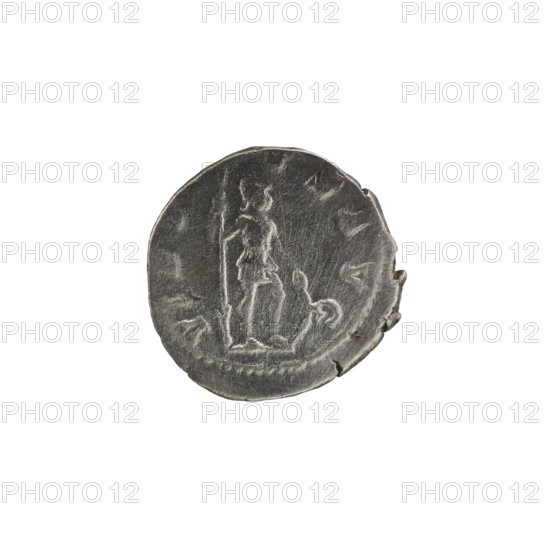 Denarius, Alexander Severus Roman emperor; 222–235. Obverse: Bust of Alexander Severus with laurel wreath and paludamentum facing right; pearl rim. Inscription: IMPCMAVRSEVALEXANDAVG. Reverse: VIRTVSAVG. Virtus in military garb and helmet facing right, holding a spear point down in his right hand and resting his left hand on a shield at his feet; pearl rim. Date: 222–228. Place of origin: Rome, Roman Empire. Type: coin. Diameter: 18.0–18.5 mm. Weight: 2.65 g., A round, worn metallic object with a dark gray surface and lighter gray highlights showing raised, scratched details; the object has an uneven edge with a small chipped area and visible surface texture; faint, rough linear and curved markings form an indistinct central raised figure and surrounding shapes; overall colors visible are dark gray and lighter gray against a white background.