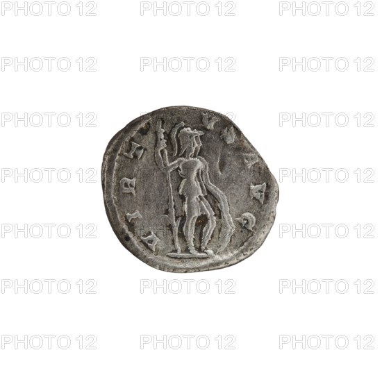 Denarius, personifications, Virtus personification, Alexander Severus Roman emperor; 222–235 - iconography. Obverse: IMPCMAVRSEV ALEXANDAVG. Bust of Alexander Severus with laurel wreath and paludamentum facing right, pearl rim. Reverse: VIRTVSAVG. Virtus in military garb and helmet facing right, holding a spear point down in his right hand, resting his left hand on a shield at his feet, pearl rim. Date: 222–228. Roman Empire 27 BC–476, Rome. Coin. Diameter: 17.0–19.0 mm. Weight: 2.80 g., A round, worn coin with a metallic gray surface showing a raised, central figure standing and holding a long staff; the figure appears to wear a helmet and a draped garment. The coin's edge is irregular and the surface shows darker gray spots and lighter gray highlights from wear and relief. The background around the coin is plain white.