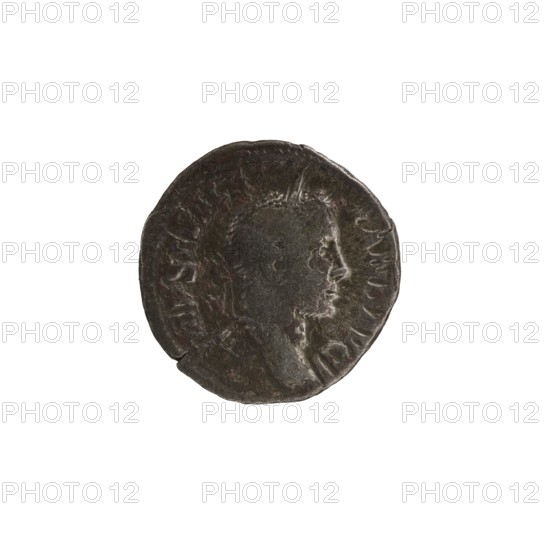 Denarius; obverse: IMP SEV ALEXAND AVG — head of Emperor Alexander Severus right, laurel wreath, pearl rim. Reverse: ANNO NA AVG — personification Annona standing right, left leg resting on a ship's prow, holding a rudder on an orb in her right hand and a modius with ears of corn in her left, pearl rim. Roman Empire, 228–231 CE. Rome mint. Coin; diameter ~18.5–19.0 mm; weight 2.85 g., A circular dark metallic object with a worn raised profile of a head in side view, showing facial features and short hair, surrounded by textured edges and faint raised patterns; the object appears dented and aged with uneven surfaces and subtle variations in dark gray, black, and hints of brown.