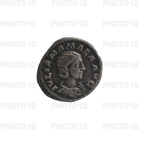 Denarius depicting Julia Mamaea ca. 180–235; Augusta 222–235 and Alexander Severus 208–235; Roman emperor 222–235; obverse/title inscriptions attributing roles, mottos, and titles; reverse showing Juno Roman deity. Iconography of Julia Mamaea 180–235. Date: 225–235, Rome, Roman Empire 27 BC–476. Coin; diameters 18.0 mm and 21.0 mm; weight 2.11 g., A round, worn coin with a raised profile of a person's head in relief on one side, showing hair pulled back and facial features in profile; the coin surface has a textured, aged appearance with uneven edges and a ring of raised elements around the portrait; colors visible include dark gray, lighter gray highlights, and subtle blackened shadows against a plain white background.
