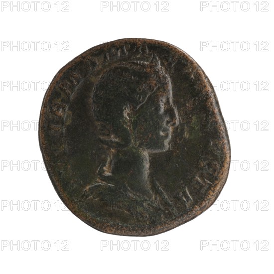 Sestertius depicting Julia Mamaea ca. 180–235 and Alexander Severus 208–235; Roman emperor 222–235. Obverse: portrait and imperial titles; reverse: Venus iconography. Date: 225–235. Roman Empire, Rome. Coin; bronze; diameters 26.5 mm and 29.0 mm; weight 17.85 g., A round, worn coin with a raised profile of a person's head facing right, showing short hair and a defined neck and shoulders, rendered with shallow relief and smooth contours; the coin's surface has areas of dark greenish-brown patina with patches of rusty brown and subtle black tones, and the rim appears uneven and slightly irregular.