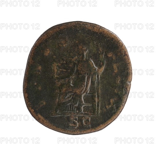 Sestertius: Julia Mamaea ca. 180–235 and Alexander Severus 208–235; Roman emperor 222–235. Obverse: portrait/inscription relating to Julia Mamaea and imperial titles. Reverse: depiction of Venus and related iconography. Date: 225–235. Place of creation: Rome, Roman Empire. Medium/function: coin. Dimensions: diameters 26.5 mm and 29.0 mm; weight 17.85 g., A round, worn coin with an irregular edge showing a mix of dark brown, greenish patina, and areas of lighter brown; faint raised shapes suggest a seated figure and an adjacent vertical form, with textured surface variations and scattered small spots of lighter brown around the perimeter.