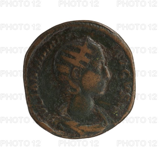 Sestertius, Julia Mamaea ca. 180–235 and Alexander Severus 208–235; Roman emperor 222–235 issuer, obverse probably showing Julia Mamaea; reverse depicting Roman deity Venus; iconography of Julia Mamaea; date: 225–235; place of creation: Rome, Roman Empire 27 BC–476; coin sestertius, diameter ~28–30 mm, weight 19.95 g., A round, worn coin with a raised profile of a person facing right in the center; the surface shows areas of dark greenish patina and brown metal with lighter brown highlights where the relief is worn, and the rim is slightly irregular.