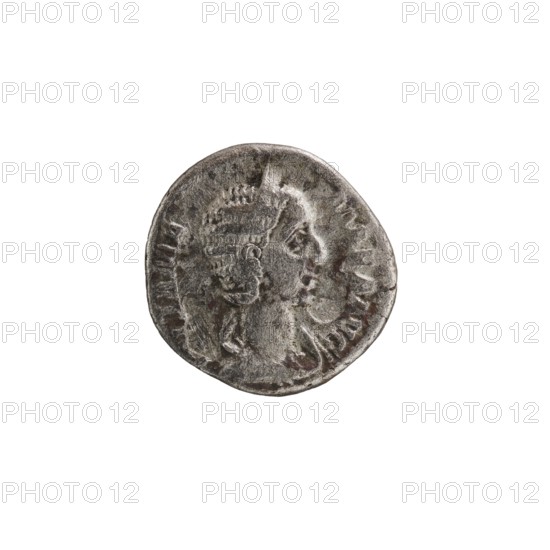 Denarius, Julia Mamaea ca. 180–235; Augusta 222–235, Alexander Severus 208–235; Roman emperor 222–235 — issuer/authority; Roman deities: Vesta; iconography of Julia Mamaea; dated 225–235, Rome; Roman Empire 27 BC–476; coin; diameter 18.5–19.0 mm; weight 2.65 g., A round metallic object with a worn surface showing a raised profile of a head facing right, featuring textured hair or a headdress and a visible ear; the object has irregular edges and varied surface wear with some darker and lighter patches, and the overall colors visible are shades of silver, gray, and small areas of darker brownish tones, set against a plain white background.