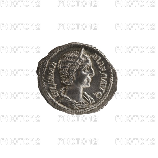 Denarius depicting Julia Mamaea ca. 180–235; Augusta 222–235 and Alexander Severus 208–235; Roman emperor 222–235. Obverse: portrait of Julia Mamaea; reverse: Roman deity Vesta. Iconography of Julia Mamaea 180–235. Date: 225–235. Place of creation: Rome, Roman Empire 27 BC–476. Material: coin. Diameter: 18.0–20.0 mm. Weight: 3.10 g., A round metallic object with a raised profile of a person facing right, showing detailed hair and facial features, surrounded by a bordered rim and decorative raised patterns; the object appears worn with uneven edges and textured surface. The visible colors include silver, gray, darker gray, and hints of brown.