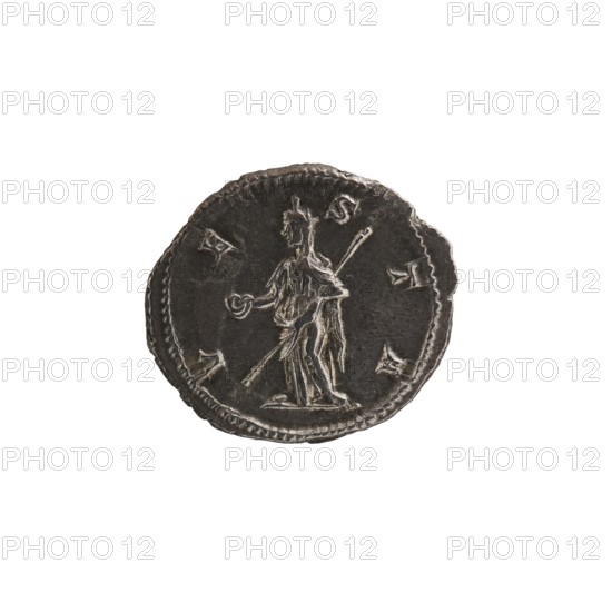 Denarius depicting Julia Mamaea ca. 180–235; Augusta 222–235 and Alexander Severus 208–235; Roman emperor 222–235; obverse/title inscriptions indicate imperial roles and titles. Iconography includes Julia Mamaea and Roman deity Vesta. Dated 225–235, Roman Empire, Rome. Coin; diameter ~18–20 mm, weight 3.10 g., A round metallic object with a dark gray surface and lighter gray raised details, showing a relief of a standing human figure holding a circular object in one hand and a long staff or spear in the other, surrounded by a decorative border and a few small raised shapes around the figure; the object has a slightly irregular edge and a worn, textured appearance with visible highlights and shadows in shades of gray.