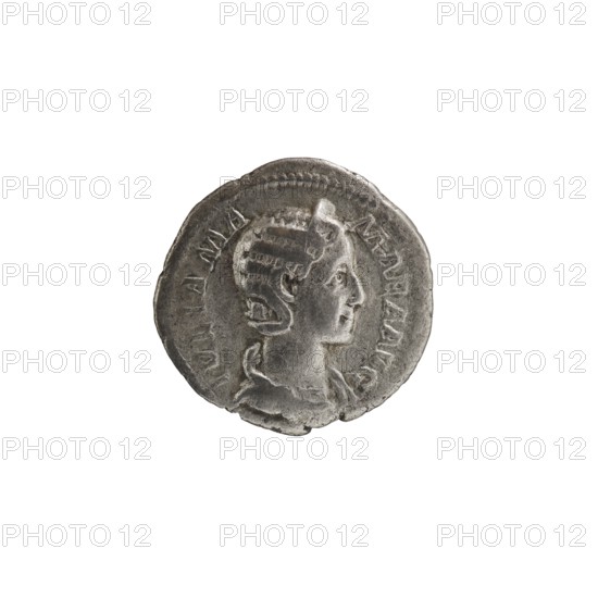 Denarius depicting Julia Mamaea ca. 180–235; Augusta 222–235 and Alexander Severus 208–235; Roman emperor 222–235; issuer: Alexander Severus. Obverse: portraits of Julia Mamaea and Alexander Severus. Reverse: Vesta Roman deity. Iconography of Julia Mamaea 180–235. Date: 225–235, Rome, Roman Empire 27 BC–476. Coin; diameter 18.5–19.0 mm; weight 2.25 g., A round metallic object with a worn surface and a raised profile of a person's head in relief, shown in side view facing right; the head has stylized hair and a visible ear, and the neck and upper shoulders are depicted with draped clothing. The object appears silver-gray with darker gray areas from wear and shadow, and there are subtle lighter silver highlights on raised edges. The rim of the object is irregular and slightly uneven, and the surface shows small pits and abrasions. The background is plain white.