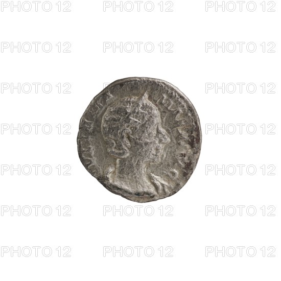 Denarius depicting Julia Mamaea ca. 180–235; Augusta 222–235 and Alexander Severus 208–235; Roman emperor 222–235, issued ca. 225–235. Obverse features imperial portraits; reverse depicts Roman deity Vesta. Iconography of Julia Mamaea 180–235. Roman Empire 27 BC–476, Rome mint. Coin: diameter 17.5–18.0 mm, weight 2.60 g., A round metallic object with a worn raised profile of a person in side view, showing facial features and hair texture, set against a slightly recessed background; the surface appears aged with uneven edges and surface pitting. The visible colors are silver-gray with darker gray and brownish spots, and small areas of lighter gray highlights.