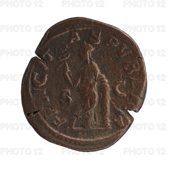 Sestertius depicting Julia Mamaea ca. 180–235 and Alexander Severus 208–235, struck 225–235 CE, Roman Empire Rome. Obverse: Julia Mamaea; reverse: personification Felicitas. Issuer: Alexander Severus. Coin type: Roman sestertius; diameter 31.5 mm obverse / 28.5 mm reverse; weight 20.45 g., A round, weathered coin with an uneven edge and a few chips, showing a raised central figure of a standing person holding an object in one hand; the surface is textured and worn with visible raised outlines suggesting clothing folds and a base beneath the figure. The coin's color is predominantly dark brown with areas of lighter brown and hints of greenish patina, and there are subtle variations in tone across the surface. The background behind the coin is plain and white.