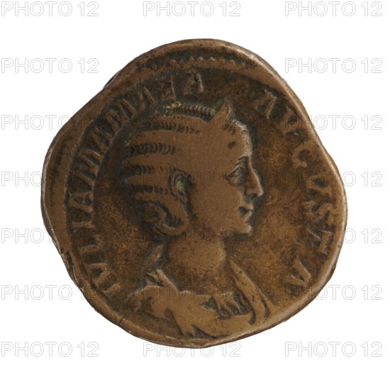 Sestertius depicting Julia Mamaea ca. 180–235 and Alexander Severus 208–235; Roman emperor 222–235. Obverse/issuer: Alexander Severus; reverse: Julia Mamaea with iconography of Fecunditas personification. Date: 222–235 CE. Place of creation: Rome, Roman Empire. Object: coin sestertius. Dimensions: diameter ~30.0–31.5 mm; weight 23.87 g., A round worn coin with a brown and darker brown patina showing a right-facing profile of a person with stylized hair and facial features, a raised rim around the edge, and uneven surface texture with lighter and darker brown areas.