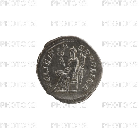 Denarius depicting Julia Mamaea ca. 180–235; Augusta 222–235 and Alexander Severus 208–235; Roman emperor 222–235. Obverse: portrait/inscription referencing rulers; reverse: Felicitas personification. Iconography associated with Julia Mamaea 180–235, dated 225–235. Roman Empire, Rome. Coin; diameter 17.5–19.0 mm, weight 2.65 g., A round metallic coin with a worn, uneven edge showing a dark gray to silver patina; the coin's surface features a raised, worn image of a seated figure on a chair holding an object, with drapery folds visible on the figure's clothing and decorative raised border around the rim; the background is plain white.