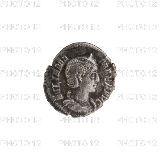Denarius depicting Julia Mamaea ca. 180–235; Augusta 222–235 and Alexander Severus 208–235; Roman emperor 222–235, issuer attributed; obverse/portrait iconography of Julia Mamaea; reverse depicting Juno Roman deity. Roman Empire, Rome; dated 225–235. Coin; diameter 17.5–19.0 mm; weight 2.45 g., A worn round metallic object with a raised profile of a head facing right in the center, showing facial features, hair pulled back, and a draped garment at the neck; the object has an uneven, irregular edge and textured surface with areas of wear and pitting; colors visible include shades of gray, silver, and darker gray to near-black tones.