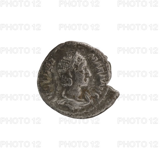 Denarius depicting Julia Mamaea ca. 180–235; Augusta 222–235 and Alexander Severus 208–235; Roman emperor 222–235. Obverse: portrait/inscription of Julia Mamaea; reverse: Juno Roman deity. Iconography of Julia Mamaea. Date: 225–235. Place of creation: Rome, Roman Empire 27 BC–476. Medium: coin. Diameter: 18.5–19.0 mm. Weight: 2.75 g., A circular metallic object with an irregular edge showing wear and a missing segment, featuring a raised profile of a person facing right with textured hair and facial features, set against a recessed background; the surface shows patina and roughness with areas of darker gray, lighter gray, and hints of brown and greenish tones.