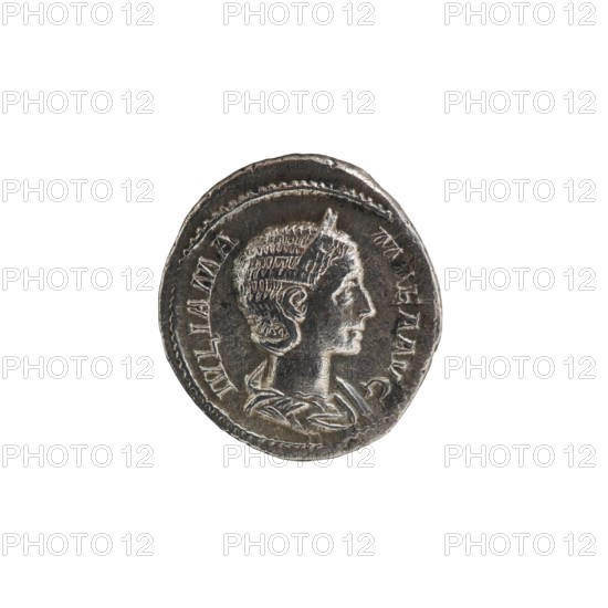 Denarius depicting Julia Mamaea ca. 180–235 and Alexander Severus 208–235; Roman emperor 222–235. Obverse: busts/portraiture of Julia Mamaea and Alexander Severus; inscriptions indicating titles and rulership. Reverse: depiction of Venus Roman deity. Dated 225–235, Roman Empire 27 BC–476, minted in Rome. Coin; diameter approx. 18.5–20.0 mm, weight 2.80 g., A circular metallic object with a raised profile of a person facing right, showing detailed hair, facial features, and part of a shoulder and neck drapery; the surface has worn and textured areas with darker and lighter metallic shades of gray and silver, and a raised outer rim surrounding the central design.