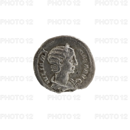 Denarius, Julia Mamaea ca. 180–235; Augusta 222–235, co-creator; Alexander Severus 208–235; Roman emperor 222–235, issuer. Obverse subjects: Roman deities, Venus; iconography of Julia Mamaea 180–235. Date: 225–235. Place: Rome, Roman Empire. Object type: coin. Dimensions: diameters 17.5 mm and 18.5 mm; weight 2.60 g., A small round metallic object with a worn, textured surface showing a raised profile of a person facing right, featuring detailed hair and facial features, set against a recessed background; the object has irregular edges and a few small chips, and appears primarily in shades of gray and silver with darker gray shadows and lighter silver highlights.