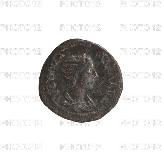 Denarius depicting Julia Mamaea ca. 180–235; Augusta 222–235 and Alexander Severus 208–235; Roman emperor 222–235 as issuer; obverse/persona details include titles and hierarchy of power. Reverse: Roman deity Venus. Iconography attributed to Julia Mamaea 180–235. Date: 225–235, Rome, Roman Empire 27 BC–476. Coin; diameter 20.5–21.0 mm; weight 3.15 g., A round metal coin with a worn raised portrait in profile at its center, showing facial features and hair details; the coin surface appears textured and aged with irregular edges and small pits. Visible colors include dark brown, black, and hints of reddish-brown and gray across the coin, set against a white background.