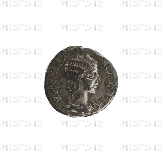 Denarius of Alexander Severus 208–235; Roman emperor 222–235, issued by Julia Mamaea ca. 180–235; Augusta 222–235. Obverse/title: ruler Alexander Severus; reverse: Fecunditas personification and iconography of Julia Mamaea. Date: 225–235. Place of origin: Rome, Roman Empire 27 BC–476. Medium: coin. Diameter: 17.5–18.0 mm. Weight: 2.02 g., A round metallic object with a worn surface showing a raised profile of a person in relief, the figure facing to the right with stylized hair; the object displays textured and uneven edges and surface wear, and the visible colors are shades of dark gray, silver, and hints of brown.