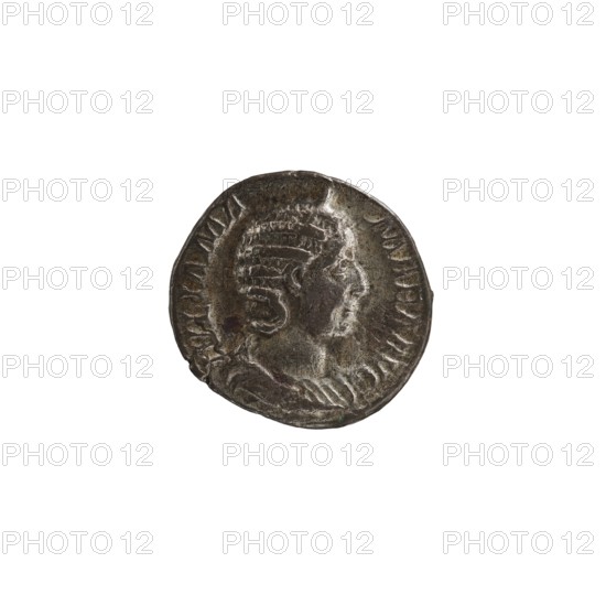 Denarius, Julia Mamaea ca. 180–235; Augusta 222–235 and Alexander Severus 208–235; Roman emperor 222–235 issuer. Obverse: portraits of Julia Mamaea and Alexander Severus. Reverse: Fecunditas personification. Date: 225–235. Place of creation: Rome, Roman Empire. Coin. Diameter: 16.5–17.5 mm. Weight: 2.95 g., A round metallic object with a worn, textured surface showing a raised profile of a person facing to the right, surrounded by a raised border and decorative ridges; the object displays colors of dark gray, silver, and hints of brown and green patina.