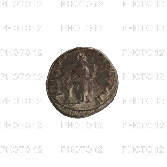 Denarius depicting Julia Mamaea ca. 180–235; Augusta 222–235 and Alexander Severus 208–235; Roman emperor 222–235. Obverse/issuer: Alexander Severus; portrait of Julia Mamaea. Reverse: personification Fecunditas. Date: 225–235 CE. Place of production: Rome, Roman Empire. Medium: silver coin. Dimensions: diameter 16.5–17.5 mm; weight 2.95 g., A round metallic object with a worn, textured surface showing a raised central area resembling a standing figure; the object displays a mix of dark brown, gray, and hints of reddish tones with lighter silvery highlights along some raised edges, and it sits against a plain white background.