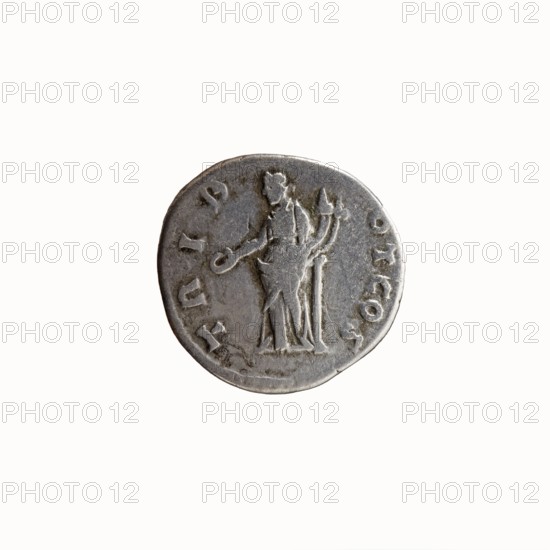 Denarius, Hadrian 76–138; Roman emperor 117–138 issued under Antoninus Pius 86–161; Roman emperor 138–161; caesar 138. Obverse: Head of Antoninus Pius bare, to right, legend IMP T AEL CAES - ANTONINVS. Reverse: Concordia standing left, right hand outstretched holding a patera, left hand resting on a slender column and holding a double cornucopia; legends include TRIB - POT COS. Iconography: Concordia, columns, personifications, pateras, cornucopias; references to Hadrian and Antoninus Pius. Date: 138. Place of origin: Rome, Roman Empire. Object: coin denarius. Dimensions: diameter 16.0–16.5 mm, weight 3.37 g, axis 180°., A circular metallic coin with a worn surface showing a raised human figure standing in profile, draped in a long garment and holding an object in one hand while another object stands beside them; the coin surface is textured with scratches and shallow relief, with a rim around the edge. The visible colors are silver-gray with darker gray patina and small areas of brown...